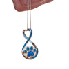 Hand holding love paw necklace pendant - lifestyle photo
